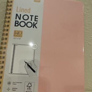 Pink lined notebook by Taja with 140 pages